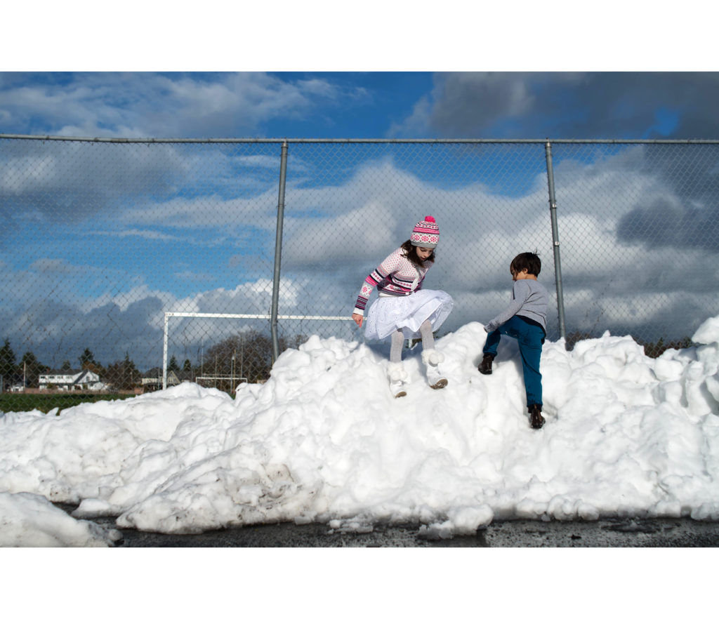 playing in the snow pile