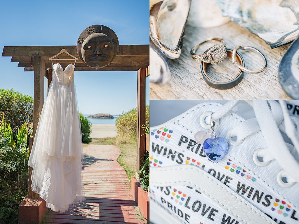 photo of a wedding dress hanging off an arbour by the beach. wedding rings and sea shels, a white sneaker covered in the words "pride wins. love wins" with a blue heart charm