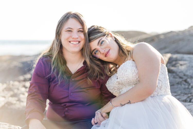wedding portrait of two brides on the beach
