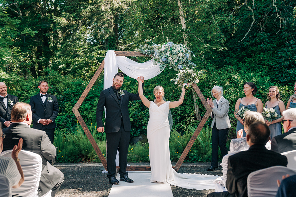 bride and groom at their wedding ceremony at University of Victoria University Club